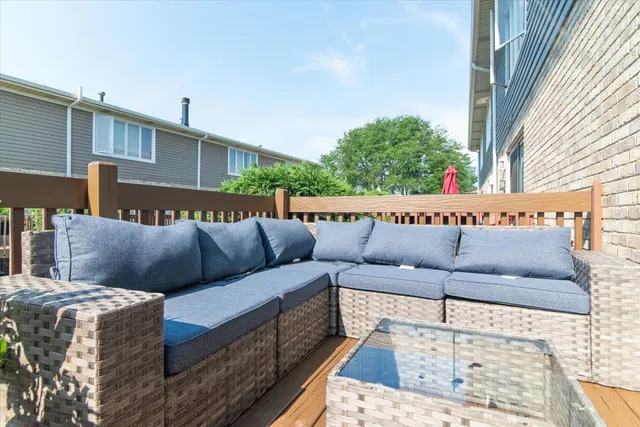 a black leather couch sitting in front of a building