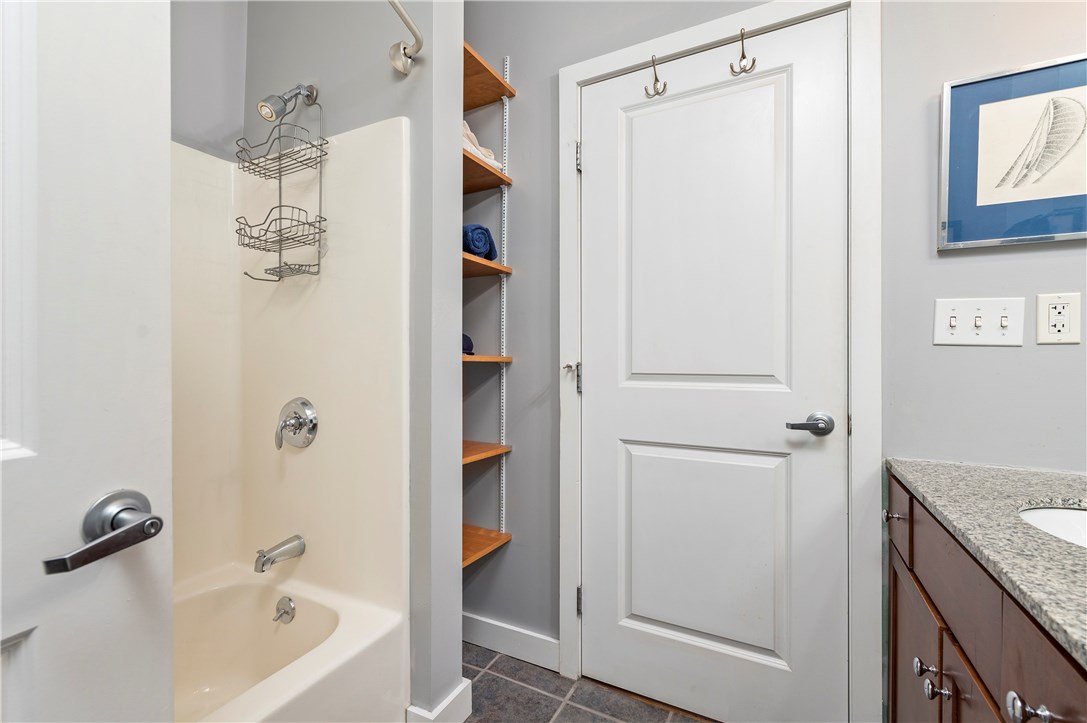 99 Allen Street, Unit 106 Woonsocket, RI 02895 - Photo 13 of 29 Full bath with tub and shower, ceramic tile flooring