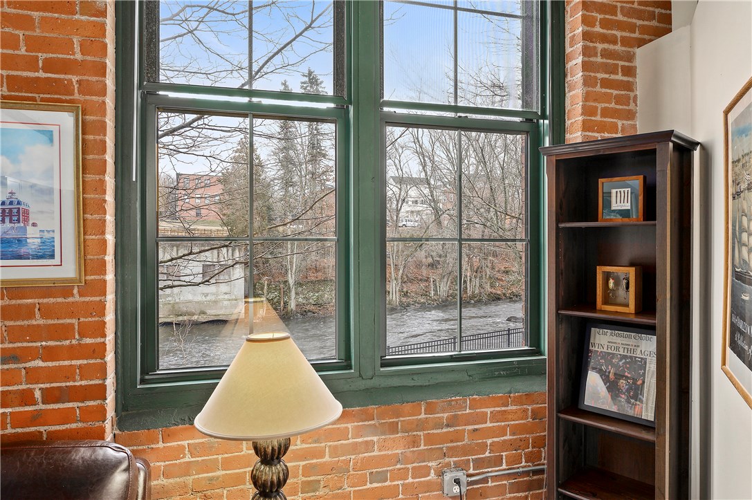 99 Allen Street, Unit 106 Woonsocket, RI 02895 - Photo 8 of 29 Exposed brick and tons of natural light
