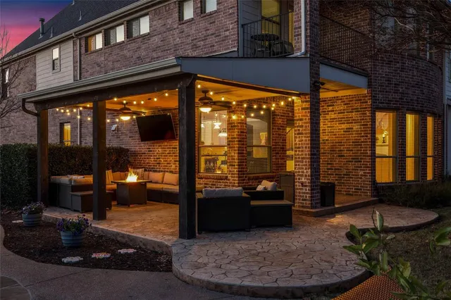 a view of a porch with furniture and floor to ceiling window