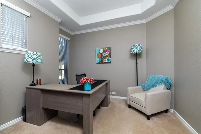 a living room with furniture and flowers