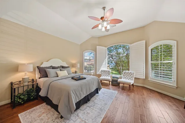 a bed room with a bed and a chandelier