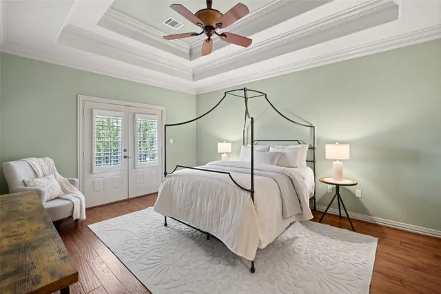 a bedroom with a bed couch and window