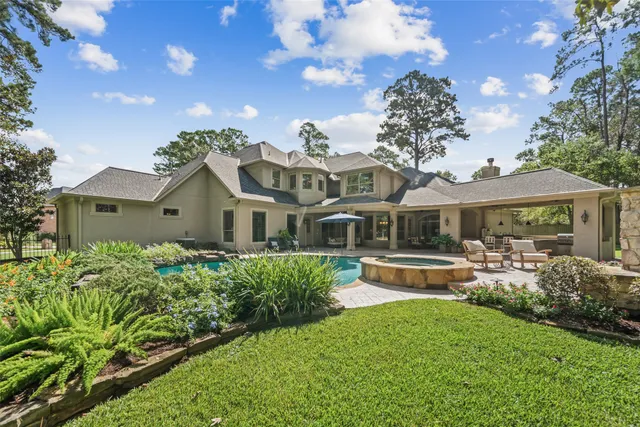 a front view of house with yard and outdoor seating