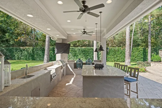 a living room with large trees and furniture