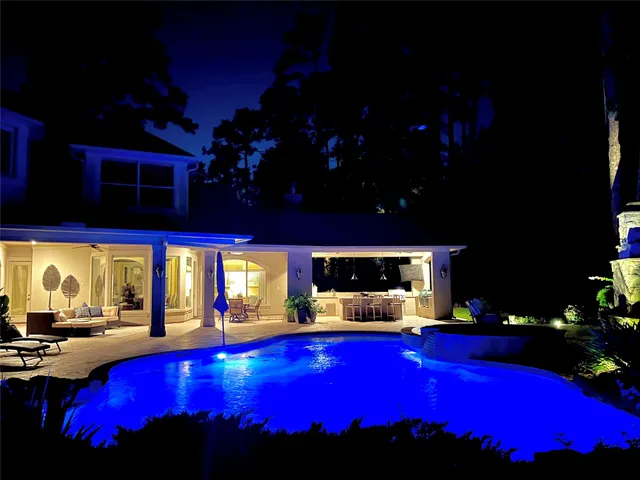 a view of swimming pool with outdoor seating