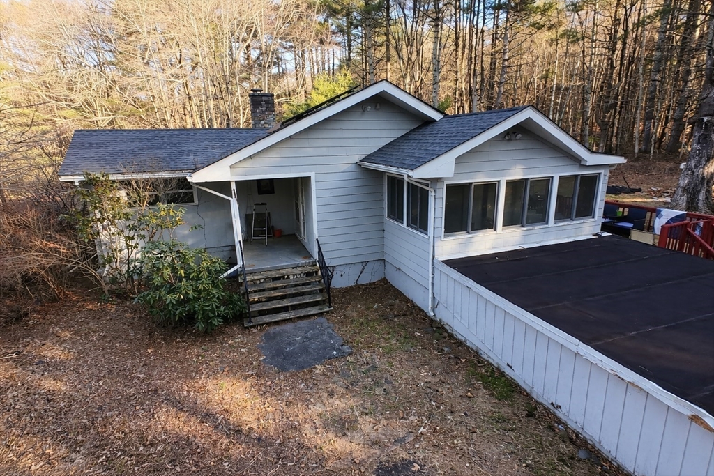 389 West Main Street Dudley, MA 01571 - Photo 4 of 19 a front view of a house with a yard