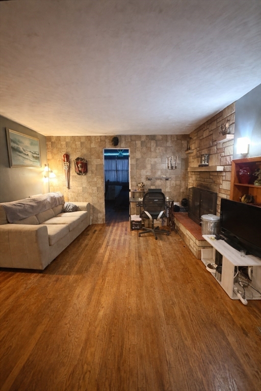 389 West Main Street Dudley, MA 01571 - Photo 8 of 19 a living room with furniture and a flat screen tv