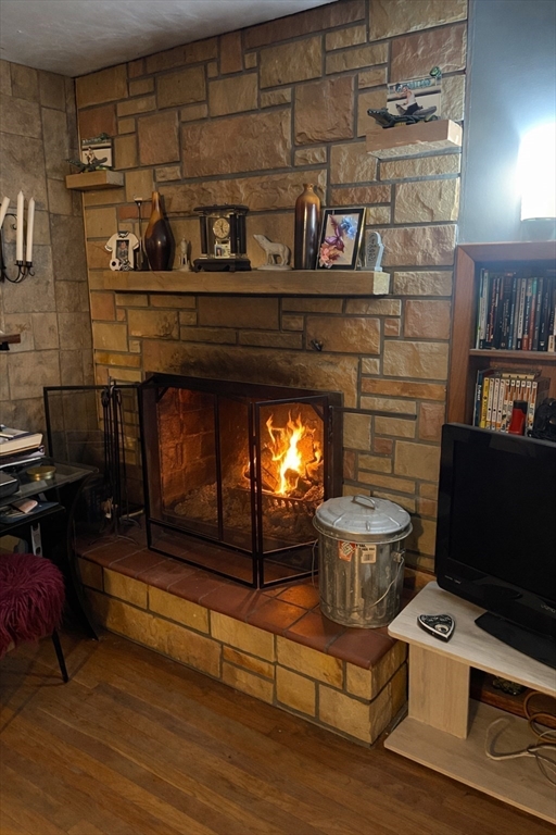 389 West Main Street Dudley, MA 01571 - Photo 9 of 19 a living room with furniture and a fireplace