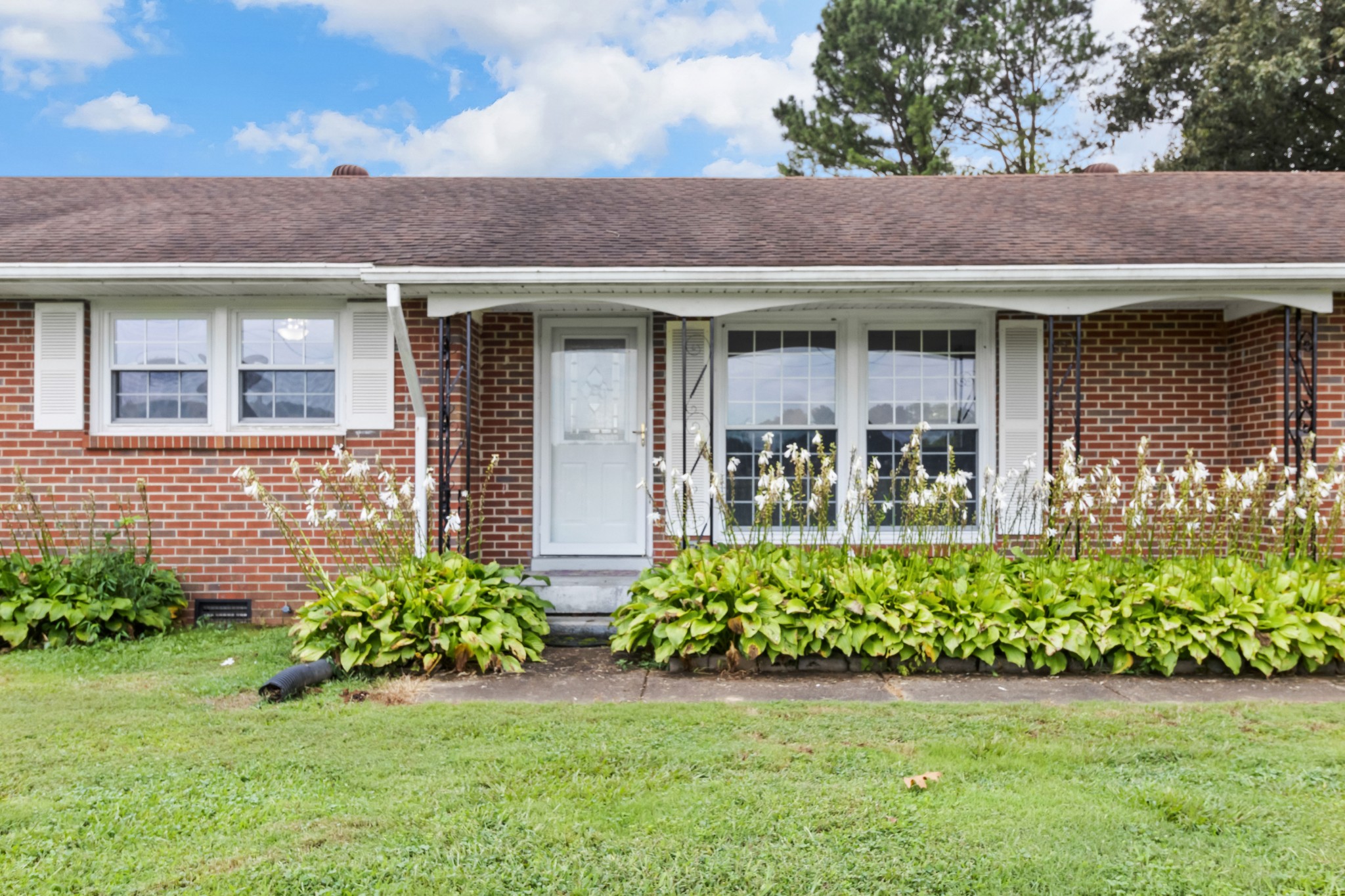3674 Rossview Road Adams, TN 37010 - Photo 36 of 40 a front view of a house with a yard
