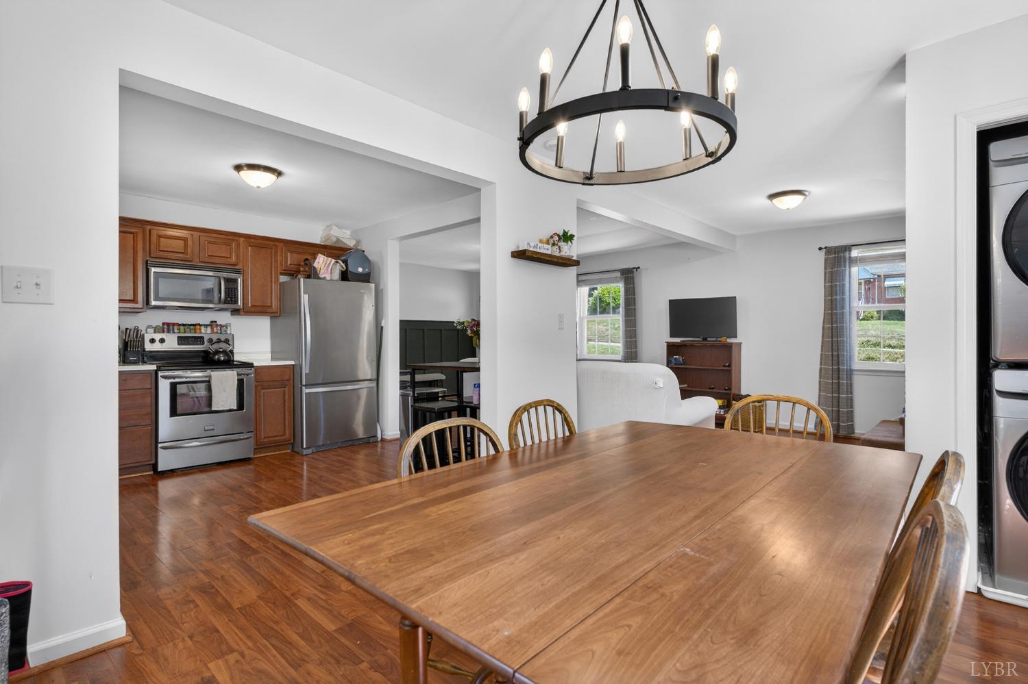 1305 Harding Street Lynchburg, VA 24502 - Photo 20 of 33 a room with stainless steel appliances a table chairs and a chandelier
