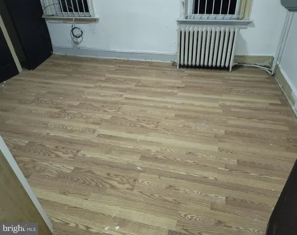 a view of a hardwood and front door