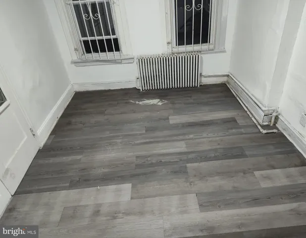 a view of a hallway with stairs