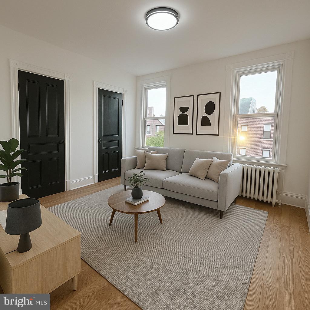 260 West Queen Lane Philadelphia, PA 19144 - Photo 30 of 34 a living room with furniture and a wooden floor