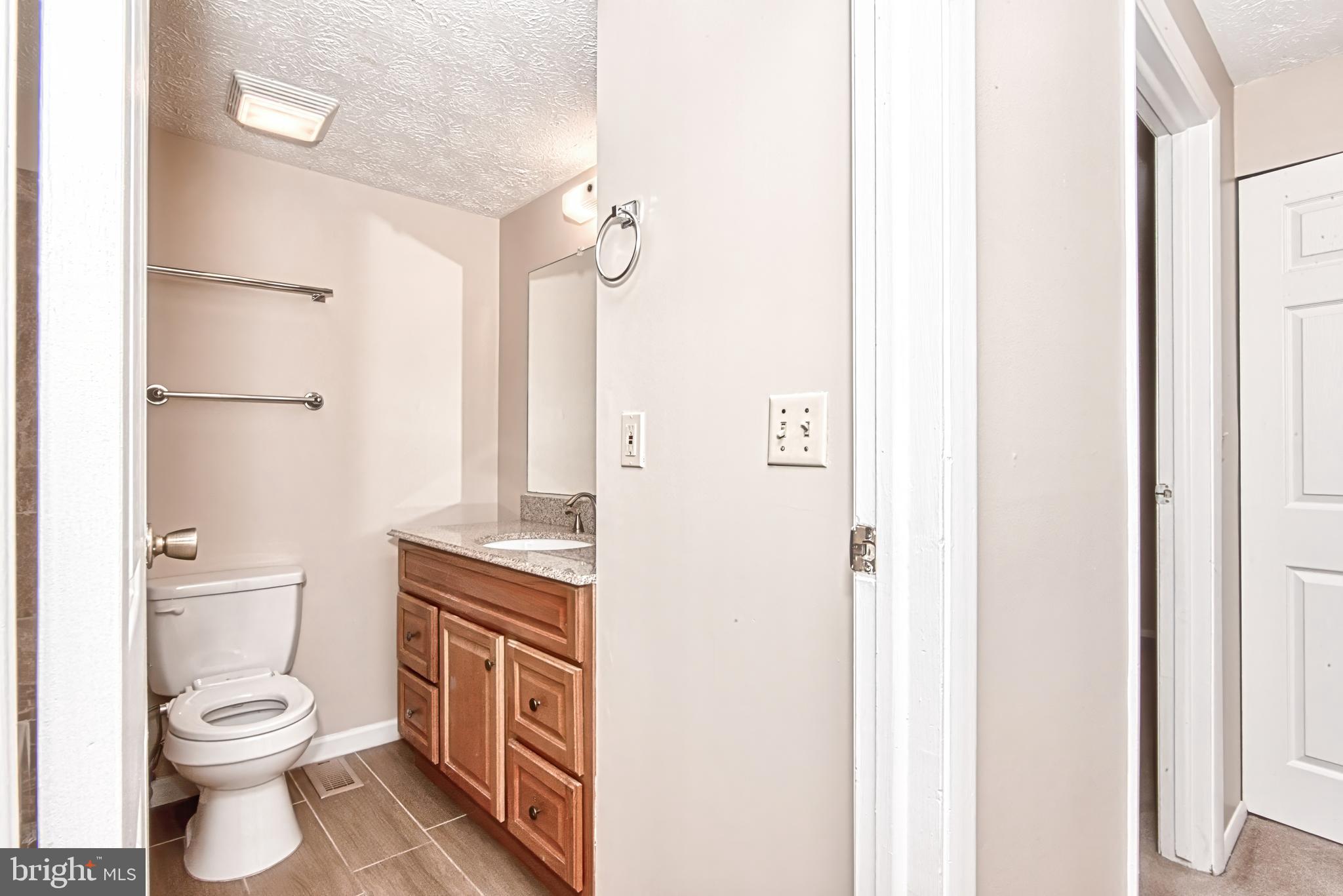 12828 Pinecrest Road Herndon, VA 20171 - Photo 17 of 46 Hall Bathoom