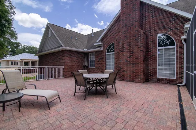 a bathroom with a granite countertop toilet a sink and a mirror