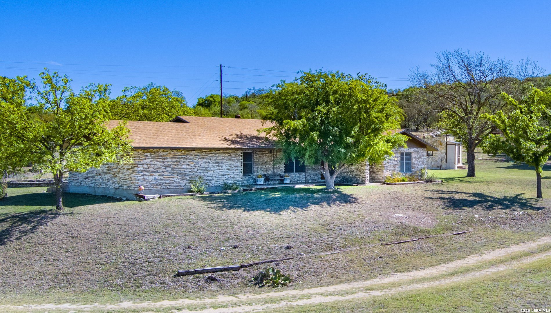 542 Ranch To Market 473 Comfort, TX 78013 - Photo 1 of 31 a front view of a house with a yard and garage