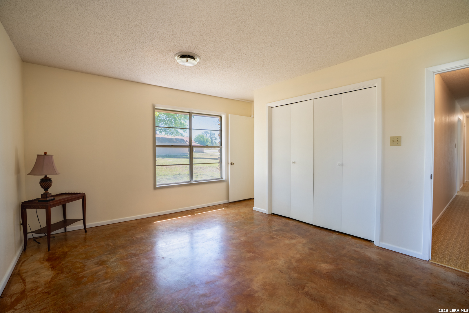 542 Ranch To Market 473 Comfort, TX 78013 - Photo 13 of 31 a view of an empty room with a window and wooden floor