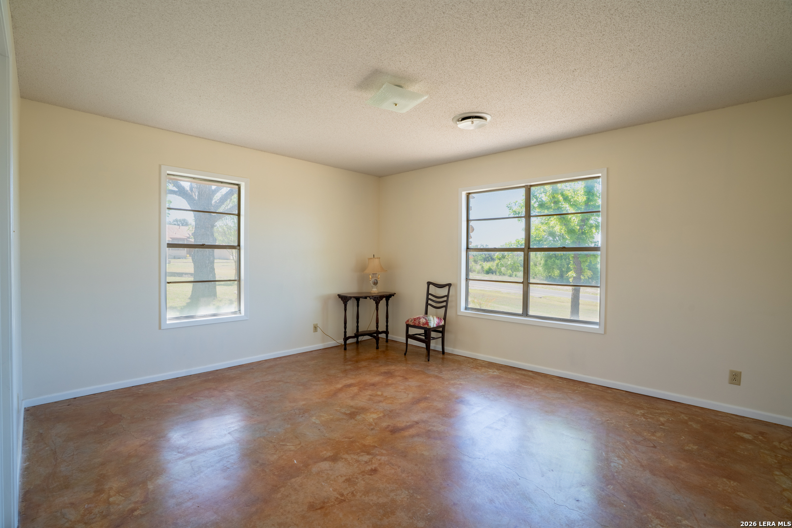 542 Ranch To Market 473 Comfort, TX 78013 - Photo 17 of 31 an empty room with wooden floor and windows