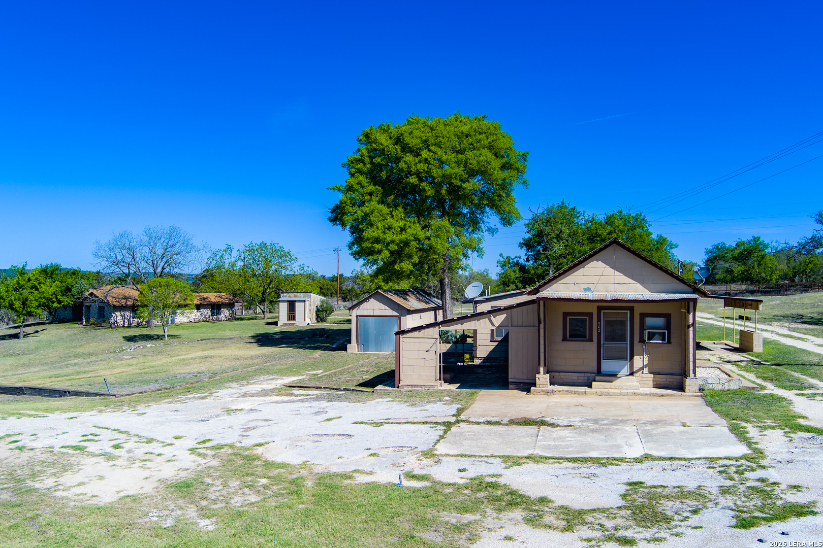 542 Ranch To Market 473 Comfort, TX 78013 - Photo 20 of 31 a front view of a house with a yard