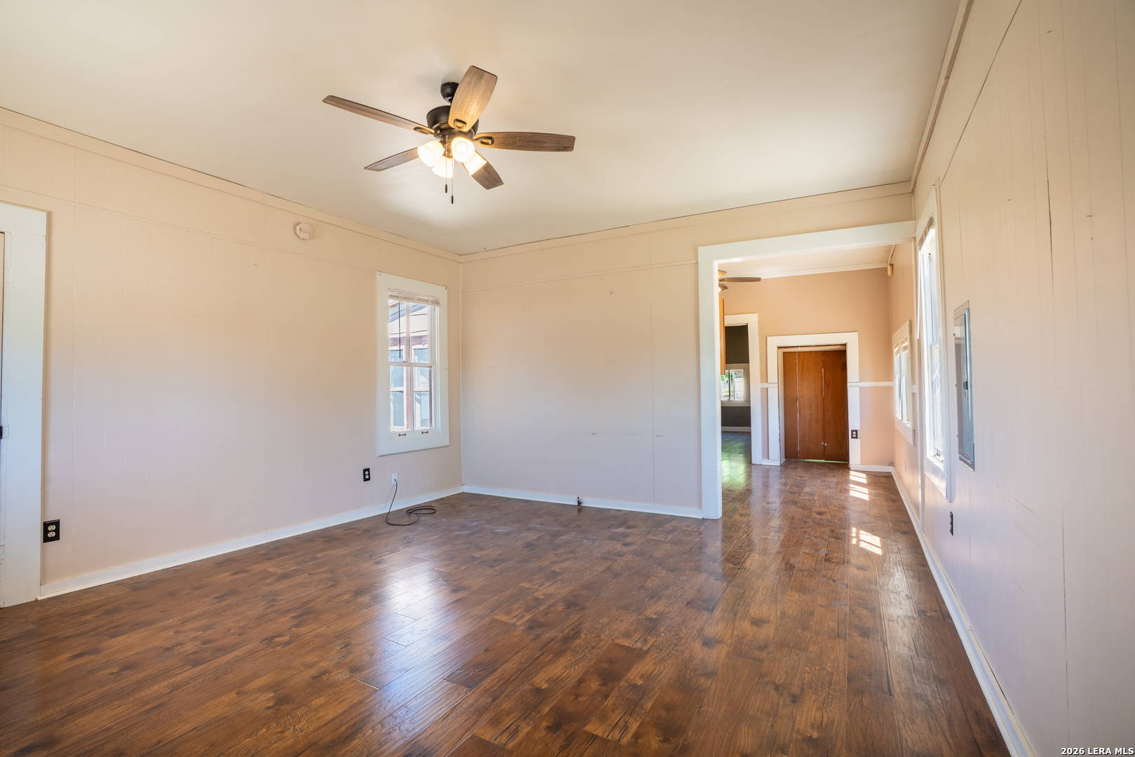 542 Ranch To Market 473 Comfort, TX 78013 - Photo 22 of 31 a view of an empty room with wooden floor and a ceiling fan
