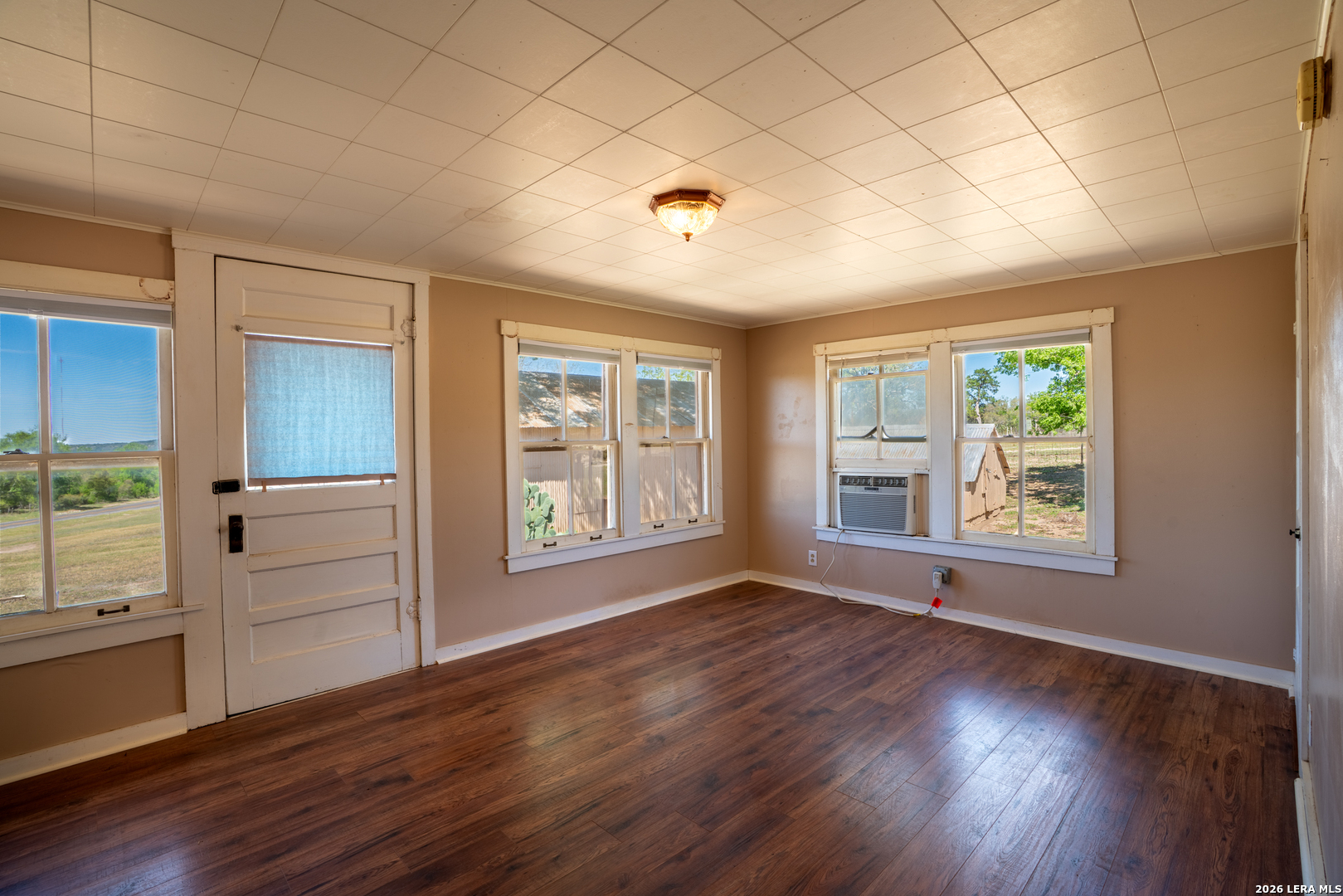 542 Ranch To Market 473 Comfort, TX 78013 - Photo 28 of 31 a view of an empty room with a window and wooden floor