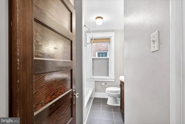 a view of bathroom with a toilet and a shower