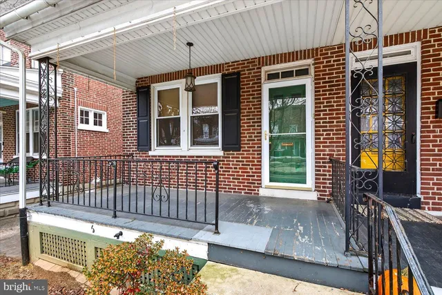 a front view of a house with a porch