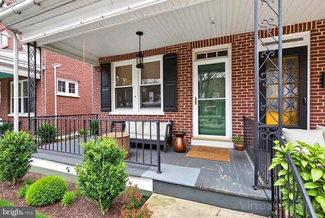 a front view of a house with a porch