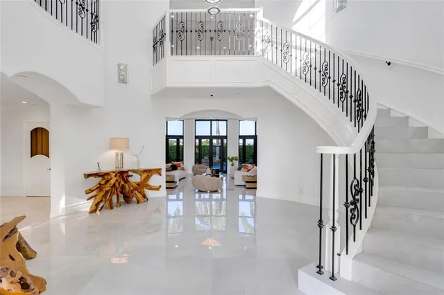 a kitchen with a sink a microwave a stove and cabinets