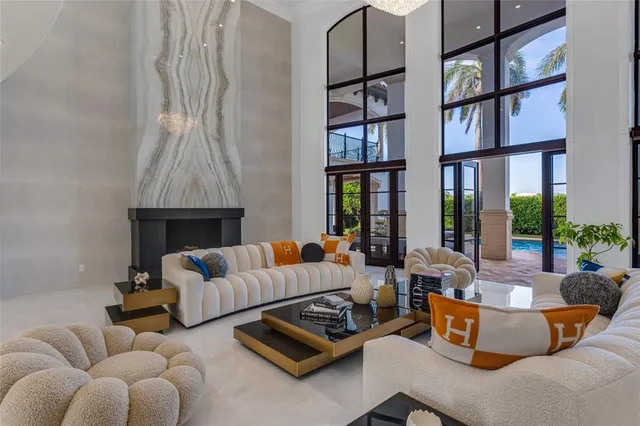 a dining room with furniture and chandelier