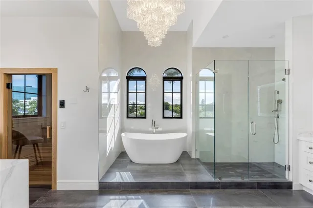 a front view of a house with swimming pool and furniture