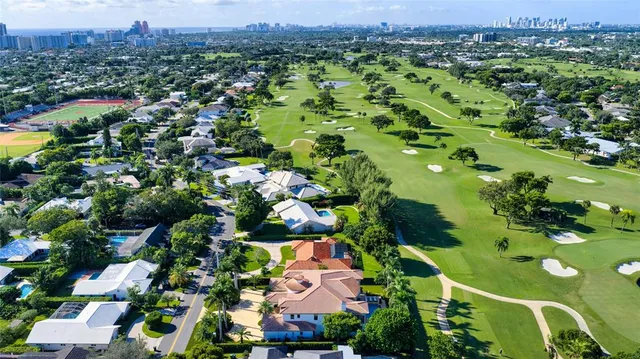 a view of a house with a yard and a fireplace