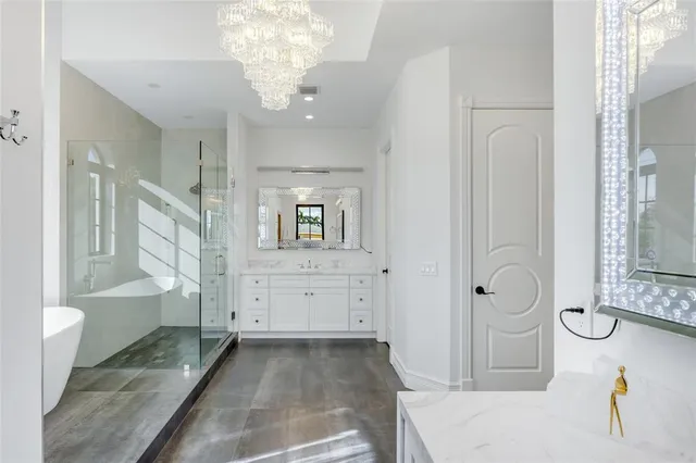 a view of a house with large windows and a fireplace