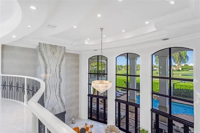 a front view of a house with garden and patio