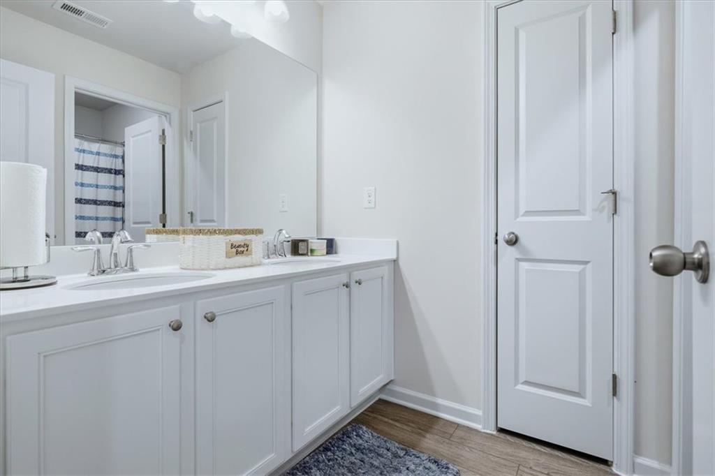 3980 Riverchess Drive Southwest Atlanta, GA 30331 - Photo 18 of 46 a bathroom with a sink and a mirror