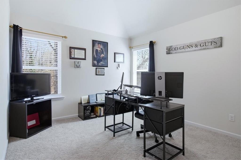 3980 Riverchess Drive Southwest Atlanta, GA 30331 - Photo 20 of 46 a view of a workspace with furniture and a flat screen tv