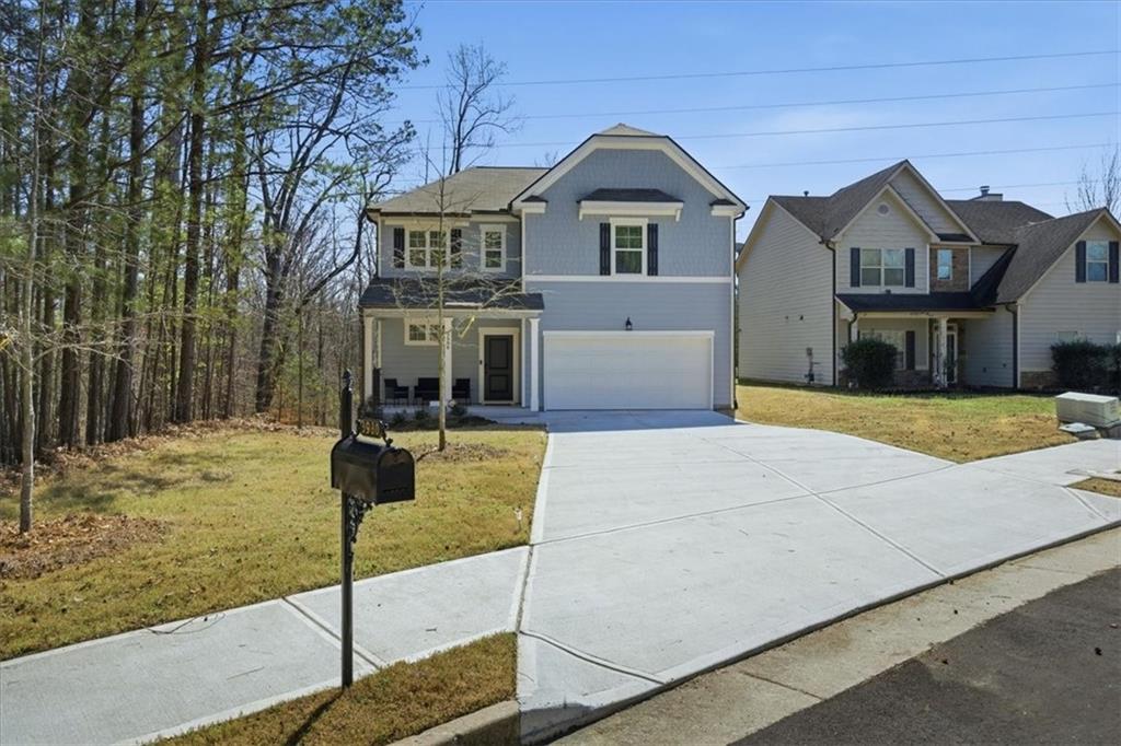 3980 Riverchess Drive Southwest Atlanta, GA 30331 - Photo 2 of 46 a front view of a house with garden