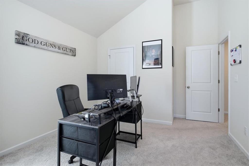 3980 Riverchess Drive Southwest Atlanta, GA 30331 - Photo 21 of 46 a view of a workspace with furniture and a window