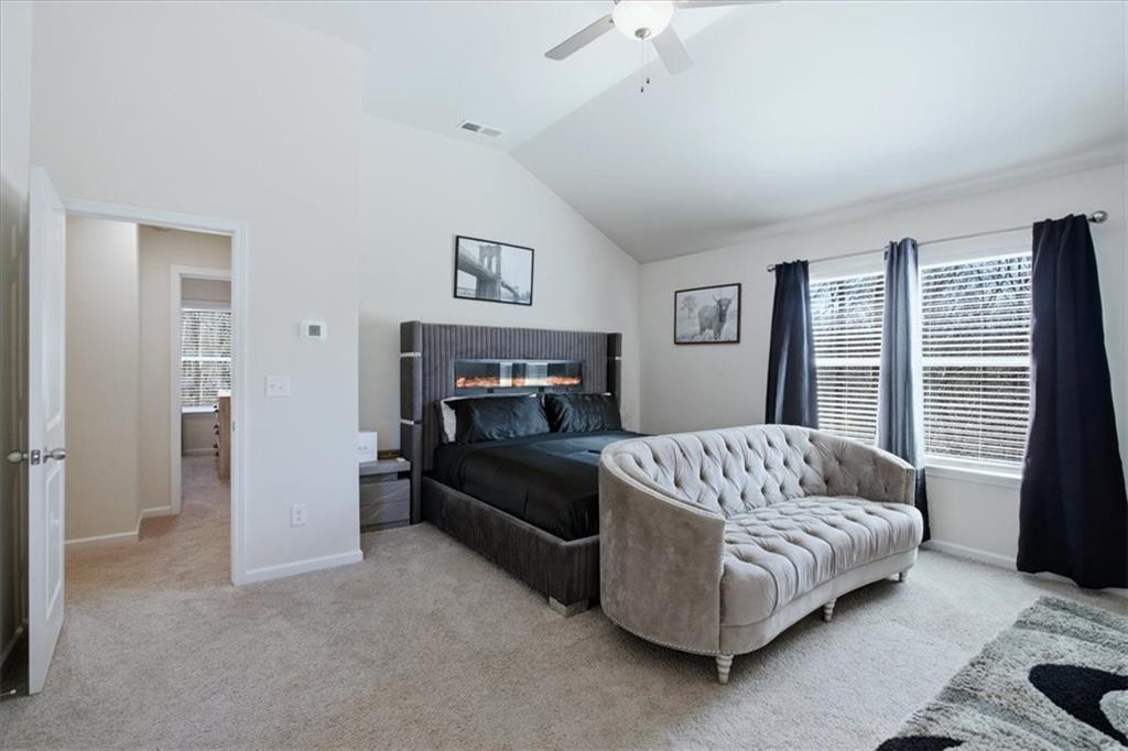 3980 Riverchess Drive Southwest Atlanta, GA 30331 - Photo 23 of 46 a bed room with a bed and a couch