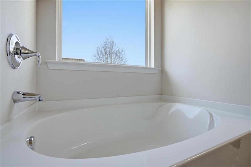 3980 Riverchess Drive Southwest Atlanta, GA 30331 - Photo 26 of 46 a view of a bathtub in a bathroom