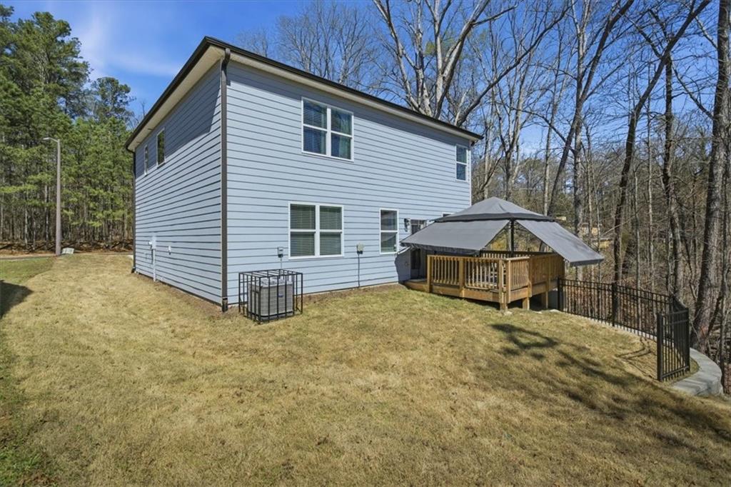 3980 Riverchess Drive Southwest Atlanta, GA 30331 - Photo 32 of 46 a view of a house with a yard and large tree