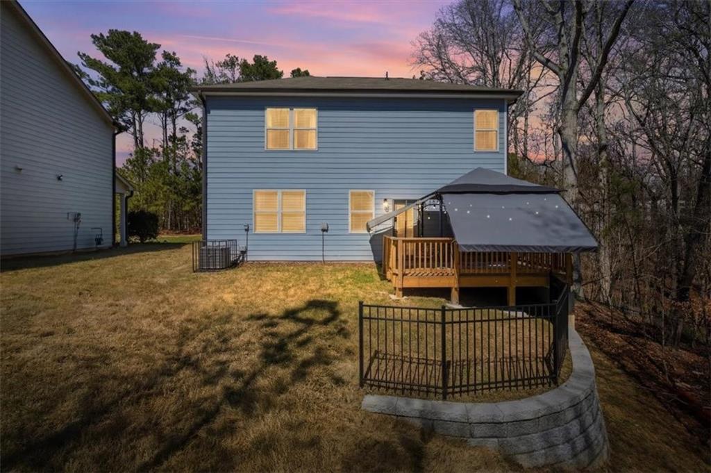 3980 Riverchess Drive Southwest Atlanta, GA 30331 - Photo 34 of 46 a view of a house with a yard and potted plants