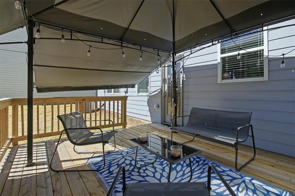 3980 Riverchess Drive Southwest Atlanta, GA 30331 - Photo 37 of 46 a roof deck with a table and chairs