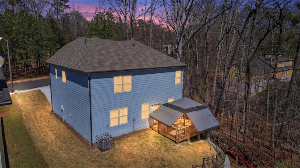 3980 Riverchess Drive Southwest Atlanta, GA 30331 - Photo 40 of 46 a backyard of a house with table and chairs
