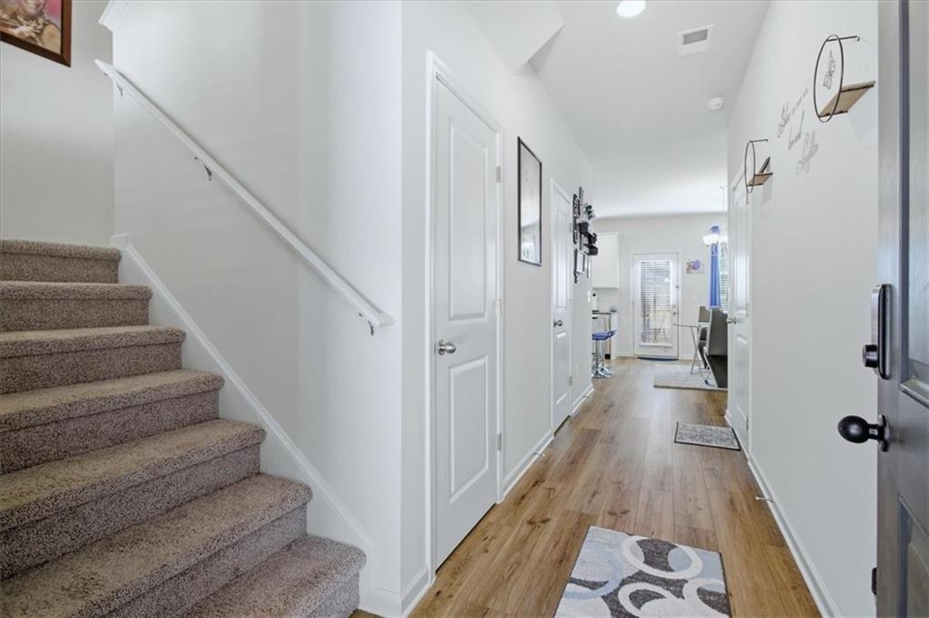3980 Riverchess Drive Southwest Atlanta, GA 30331 - Photo 4 of 46 a view of a hallway with wooden floor and staircase