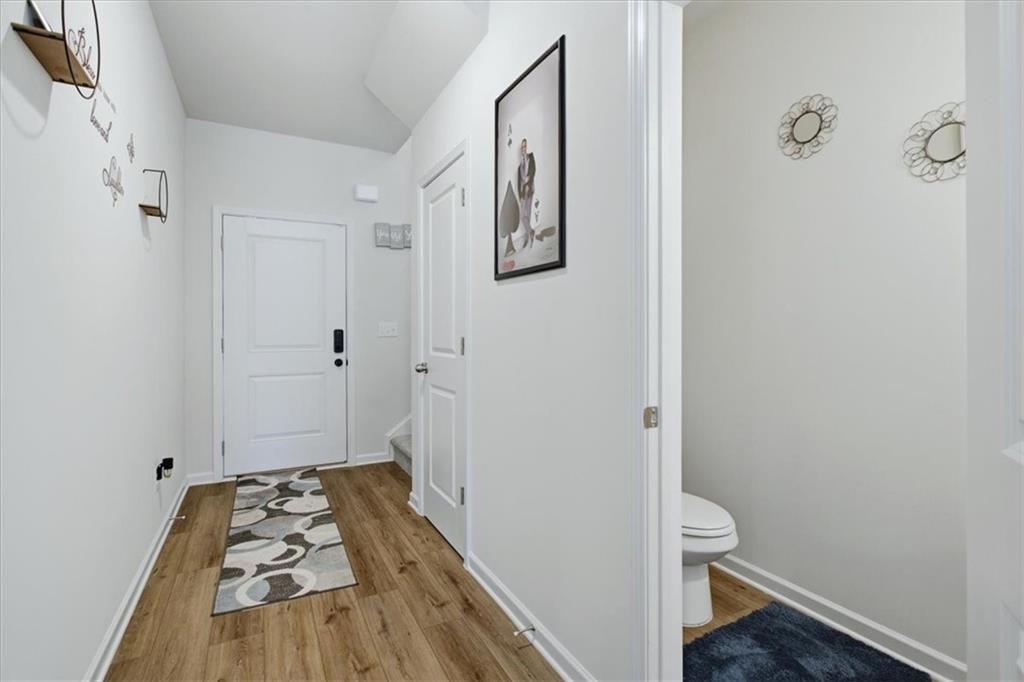 3980 Riverchess Drive Southwest Atlanta, GA 30331 - Photo 5 of 46 a view of a hallway with wooden floor and closet
