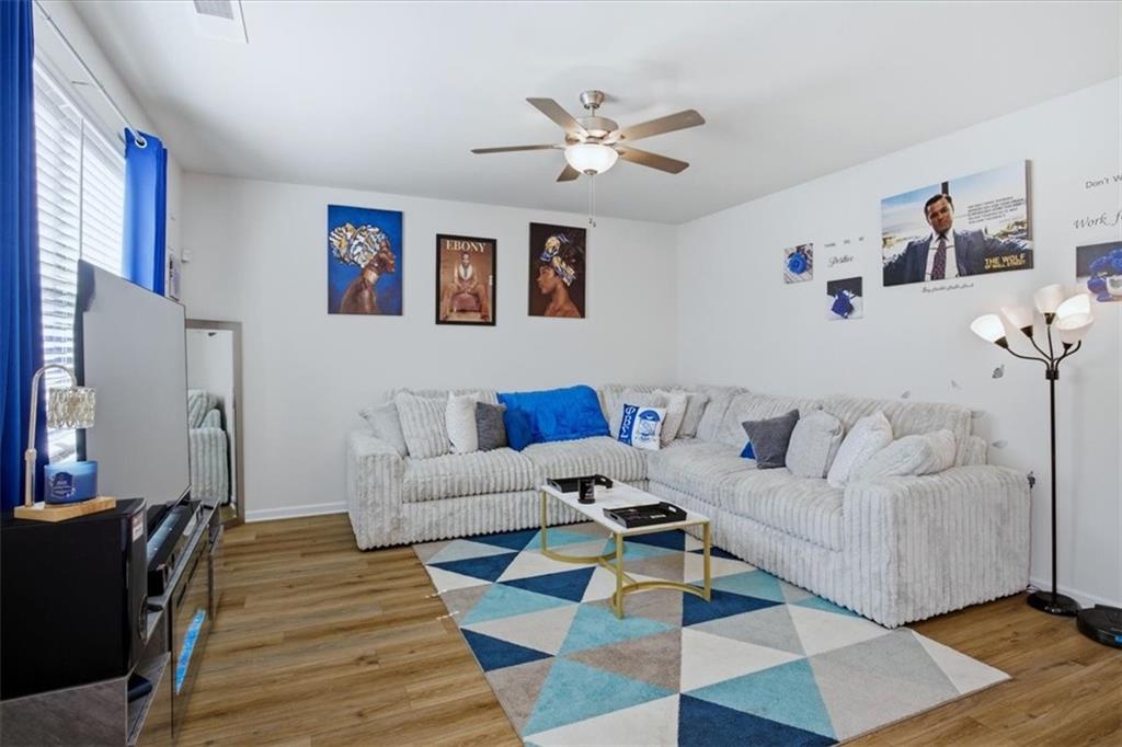 3980 Riverchess Drive Southwest Atlanta, GA 30331 - Photo 9 of 46 a living room with furniture and a rug