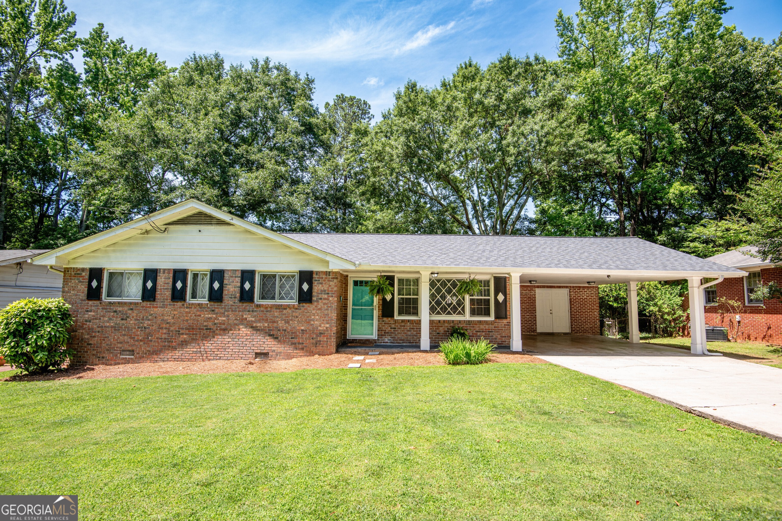 4106 Shallowford Road Atlanta, GA 30341 - Photo 1 of 1 Welcome to the highly sought-after Huntley Hills neighborhood!