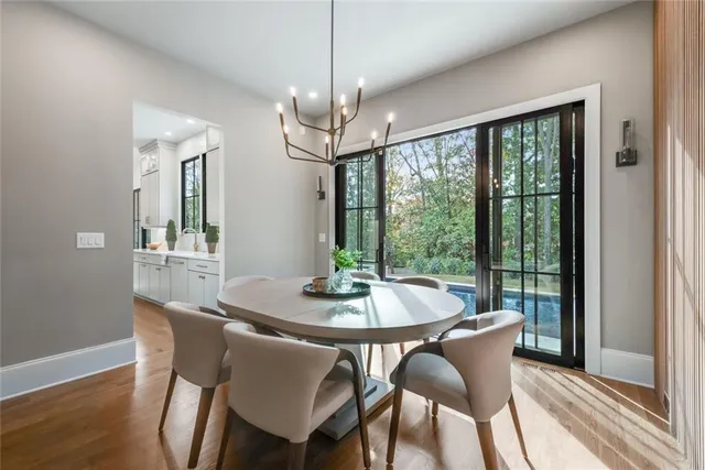 a spacious bathroom with a granite countertop sink and a mirror